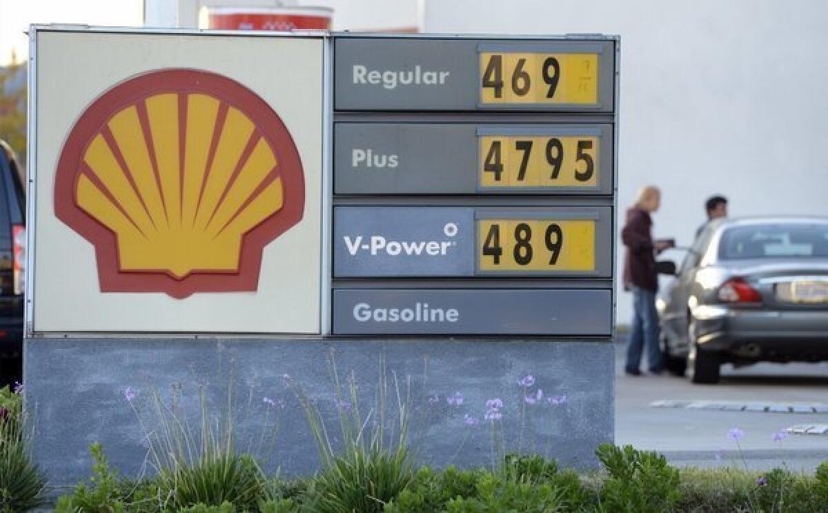 Motorists fill up at a Shell station in Pacific Palisades last month in the week in which the state's average price for a gallon of regular gasoline reached a record of $4.671. West Coast senators are calling for a federal investigation of the region's refineries.
