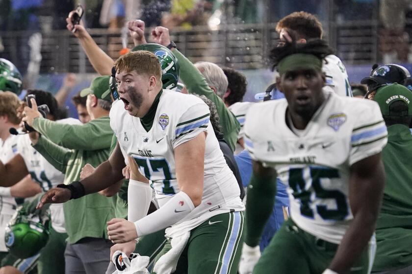 Tulane players and coaches celebrate after the Cotton Bowl NCAA college football game.