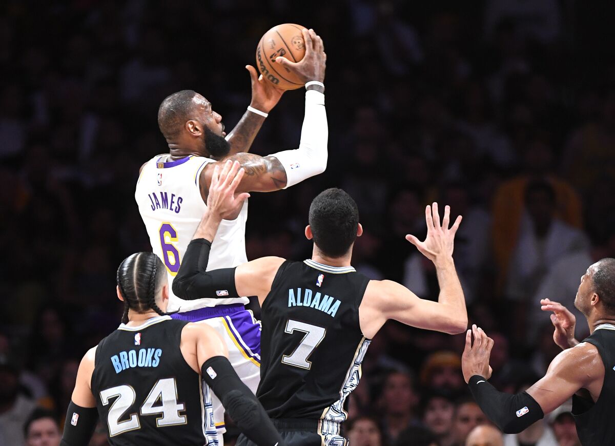 Lakers star LeBron James puts up a shot in front of the Memphis Grizzlies' defense.