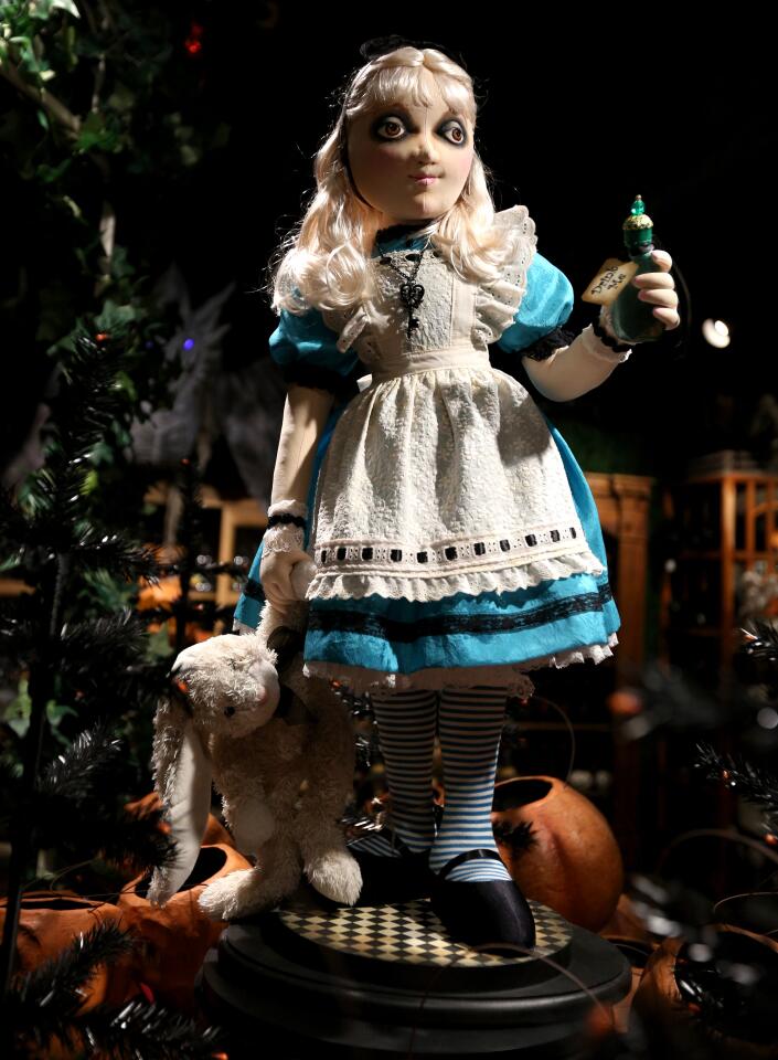 Alice explores Roger's Gardens' spooky depiction of Wonderland in its Halloween boutique.