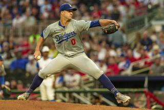 Los Angeles Dodgers pitcher Jack Flaherty throws in in the first inning of a baseball game.