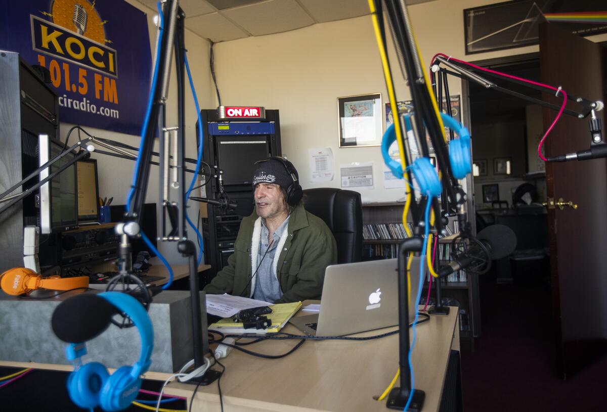 Jim Trenton talks to a listener during his morning show, "Poorman's Morning Rush," on KOCI Radio on Wednesday.