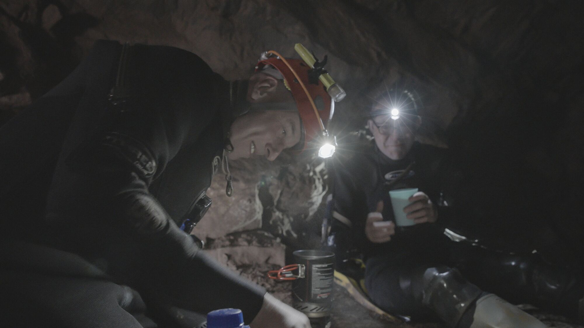 Two divers take a break inside a cave