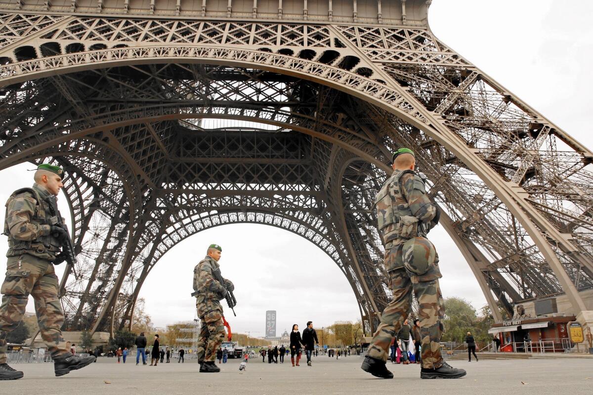 French security forces guard the Eiffel Tower after the Nov. 13 terrorist attacks in Paris.