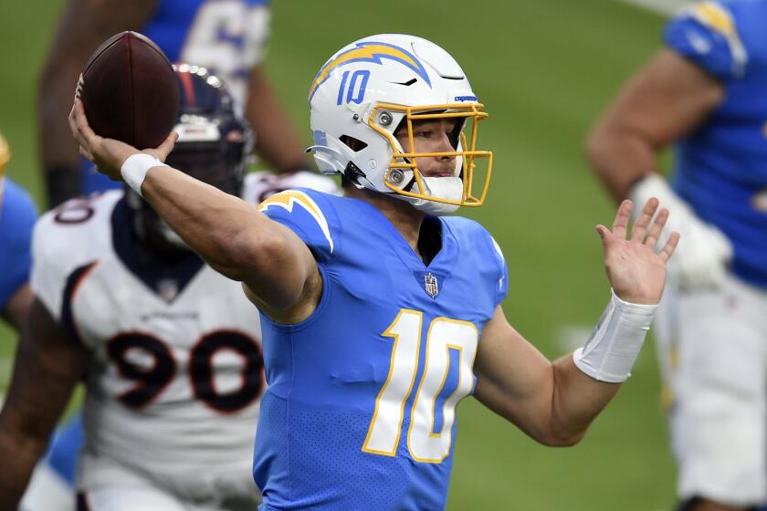 Los Angeles Chargers quarterback Justin Herbert throws against the Denver Broncos.