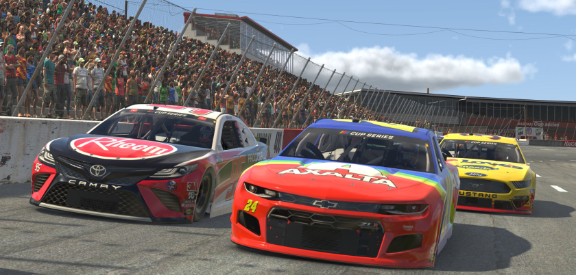 A computer-generated front view of three cars on the track during an eNASCAR iRacing event. 