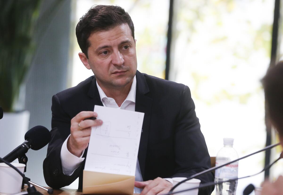 Ukrainian President Volodymyr Zelensky speaks with journalists in Kyiv, Ukraine, on Oct. 10.
