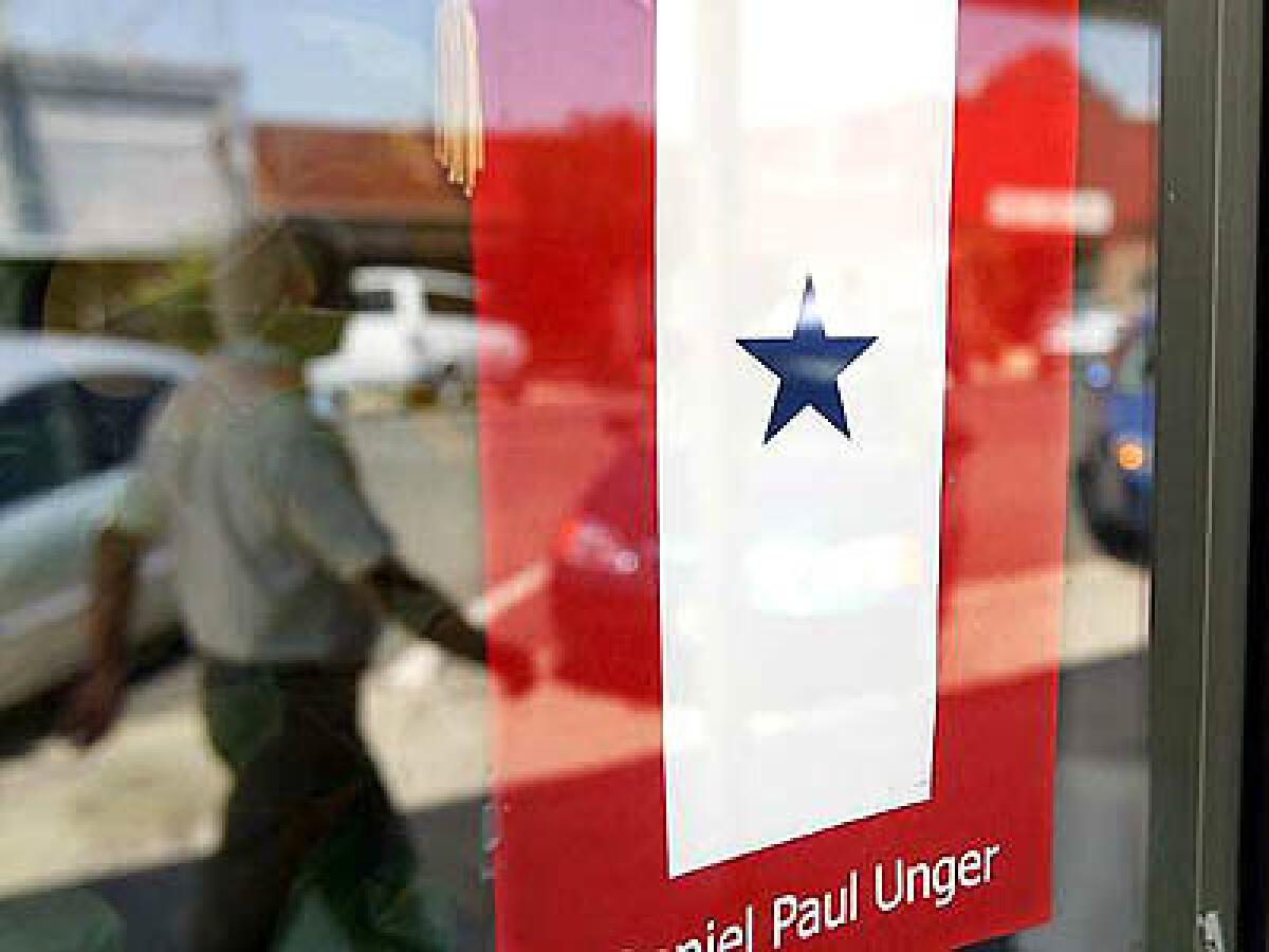 A blue star, representing a family member serving in the armed forces, hangs in the window of Marc Ungers storefront church in Exeter.