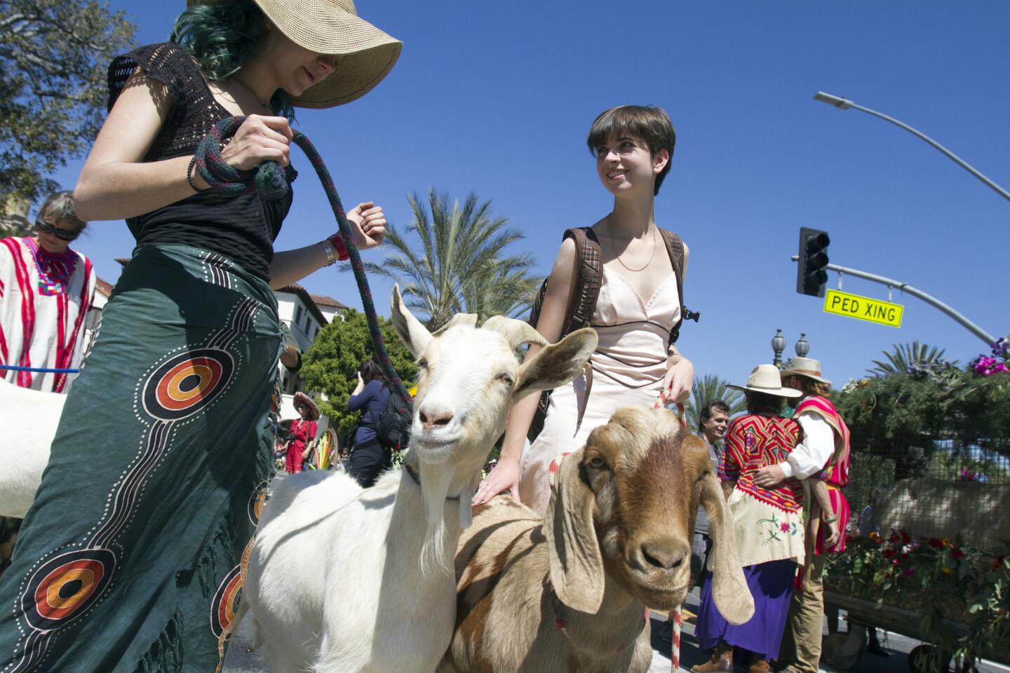 Julia Zorthian, left, and Lucia Zezza bring animals from Zorthian Ranch to an annual Blessing of the Animals, which took place at Olvera Street on Saturday.