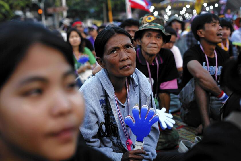 Antigovernment protesters listen to a speech in Bangkok, Thailand.