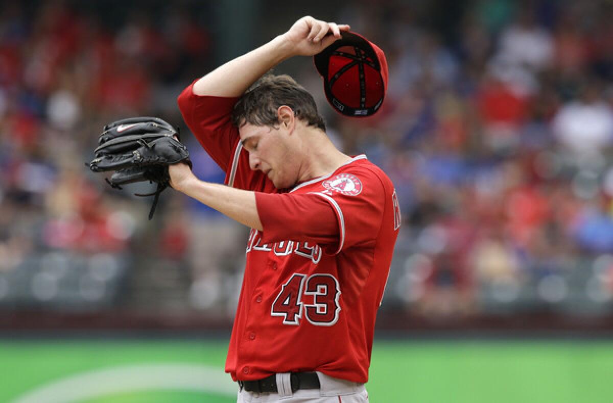 Angels starting pitcher Garrett Richards, wiping his brow between pitches Saturday, went 5-4 with a 3.72 earned-run average in 13 starts this season.