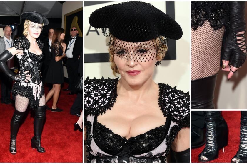 Trying too hard. Madonna's Givenchy burlesque matador outfit is a dizzy spell of details -- epaulets, fringe, face veil, hat, over-the-knee-boots and more.