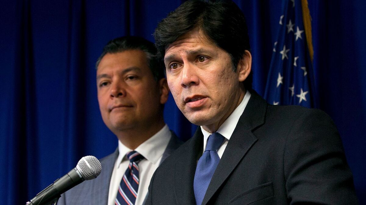 State Senate President Pro Tem Kevin de Leon (D-Los Angeles), right, backed by Secretary of State Alex Padilla, blasted the president's decision to cancel the Deferred Action for Childhood Arrivals program at a news conference on Sept. 5.