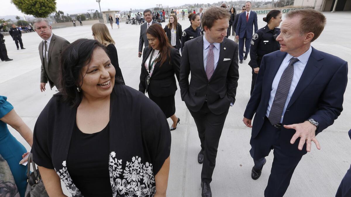 New Los Angeles Unified Supt. Austin Beutner, right, walks the Belmont High School campus with school board President Monica Garcia, left, and Vice President Nick Melvoin after making remarks.