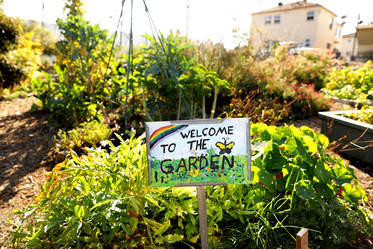 A sign reading "Welcome to the garden" at L.A. Green Grounds 