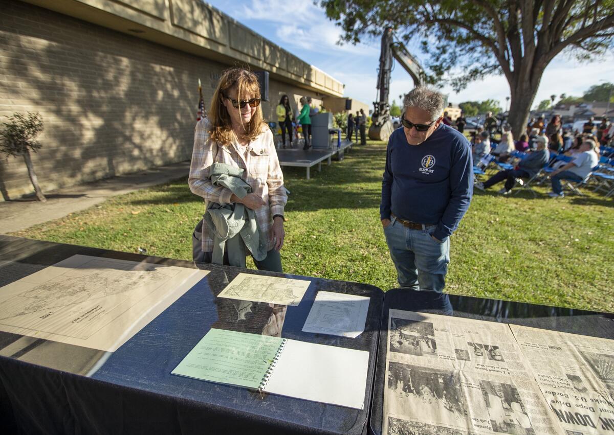 Elaine and Barry Kuhnke look over memorabilia from Park View School during a demolition ceremony for the school on Friday.