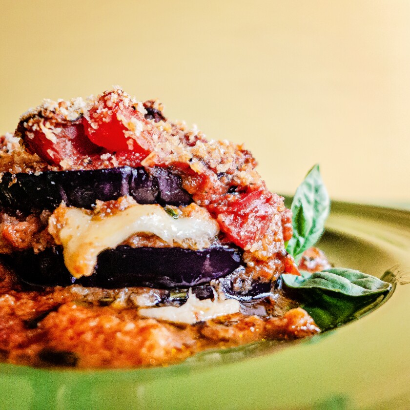 Closeup of eggplant parmesan on a plate.