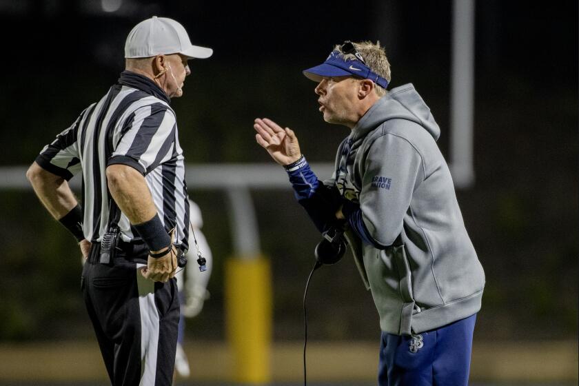SANTA ANA, CA - APRIL 17, 2021: St John Bosco head coach Jason Negro argued with an official after his team was called for pass interference on Mater Dei in the second half at Santa Ana Stadium on April 17, 2021 in Santa Ana California.(Gina Ferazzi / Los Angeles Times)