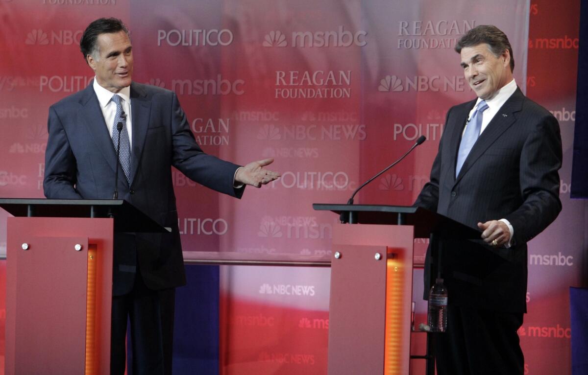 Then-candidates for the Republican presidential nomination Mitt Romney, left, and Rick Perry at the debate held at the Ronald Reagan Presidential Library on Sept. 7, 2011.