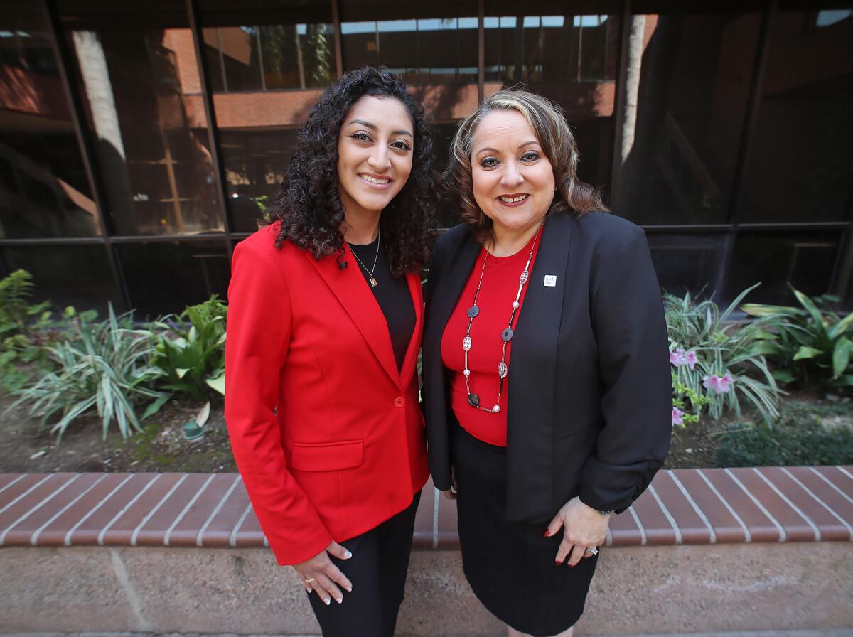 Emily Olvera and Girls Inc. of Orange County CEO Lucy Santana, from left.