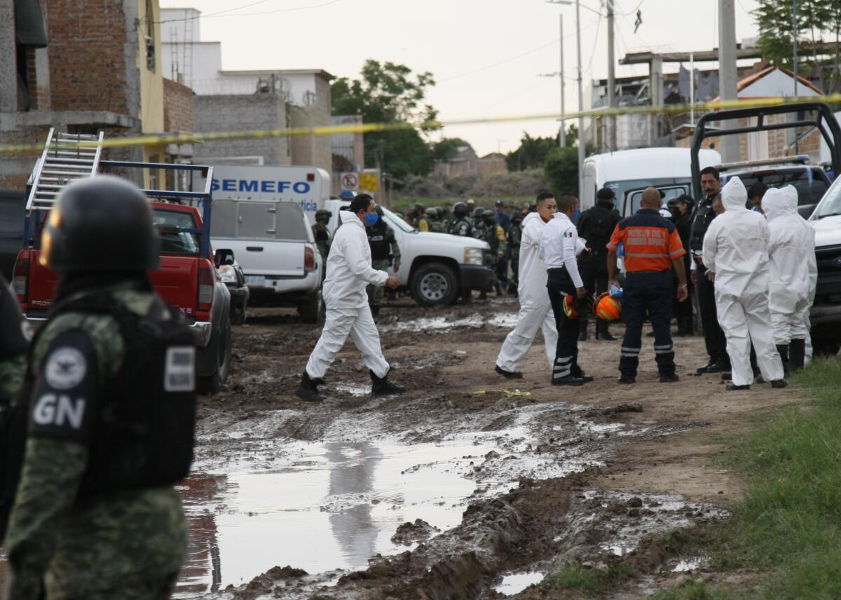 Investigators at the scene of a deadly attack at a drug rehabilitation center in Irapuato, Mexico.