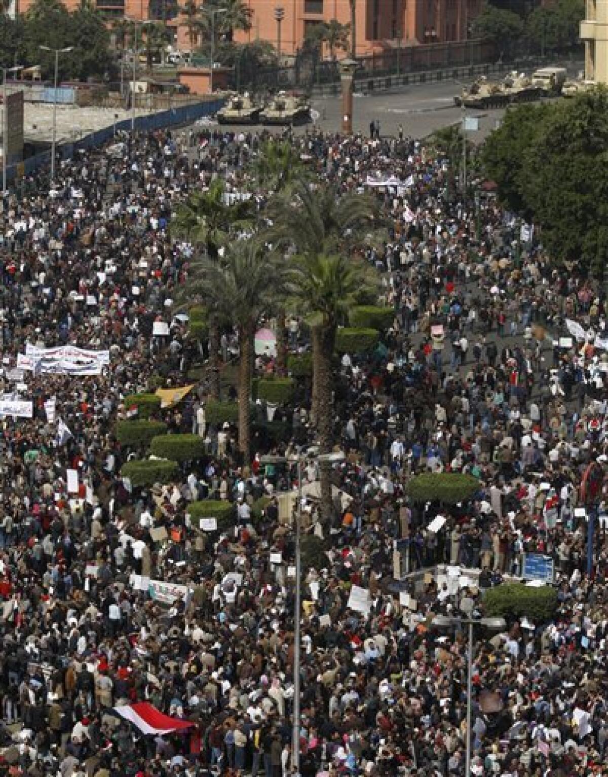 The crowd gathers in Tahrir, or Liberation, Square in Cairo, Egypt, Tuesday, Feb. 1, 2011. Tens of thousands of people flooded into the heart of Cairo Tuesday, filling the city's main square as a call for a million protesters was answered by the largest demonstration in a week of unceasing demands for President Hosni Mubarak to leave after nearly 30 years in power. (AP Photo/Khalil Hamra)