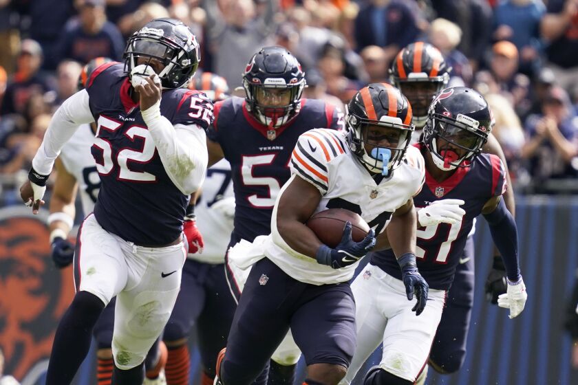 Chicago Bears running back Khalil Herbert (24) runs with the ball during the second half of an NFL football game against the Houston Texans, Sunday, Sept. 25, 2021, in Chicago. The Bears won 23-20. (AP Photo/Nam Y. Huh)