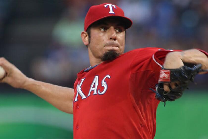The Angels have been targeting free-agent pitcher Matt Garza, shown with Texas last season, since November.