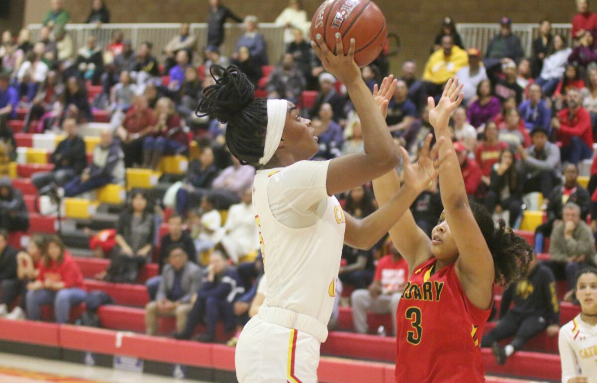 Cathedral Catholic's Taryn Johnson goes in for two of her team high 13 points.