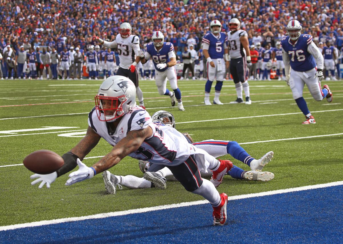 Patriots safety Patrick Chung intercepts a pass in the fourth quarter of Sunday's game against the Bills.