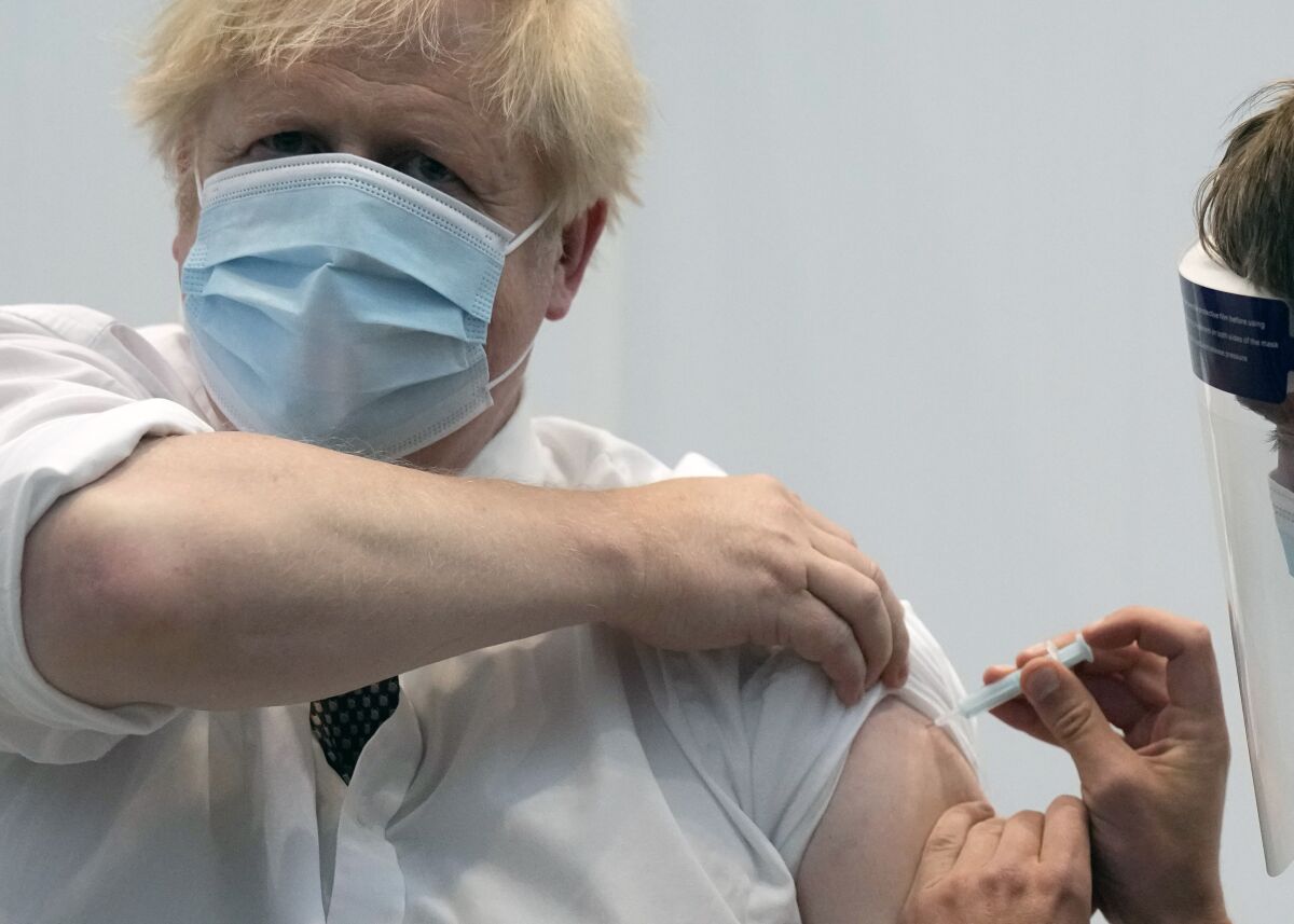FILE - In this Thursday, June 3, 2021 file photo, British Prime Minister Boris Johnson gives a thumbs up after receiving his second jab of the AstraZeneca coronavirus vaccine, at the Francis Crick Institute in London. On Friday, July 2 The Associated Press reported on stories circulating online incorrectly asserting that data from the U.K.’s public health agency confirms that those who have been vaccinated against COVID-19 are anywhere from two times to six times more likely to die from the delta variant than the unvaccinated. But, the data, which was published June 18, shows the Pfizer and AstraZeneca vaccines are highly effective against hospitalization from the variant. (AP Photo/Matt Dunham, Pool, File)