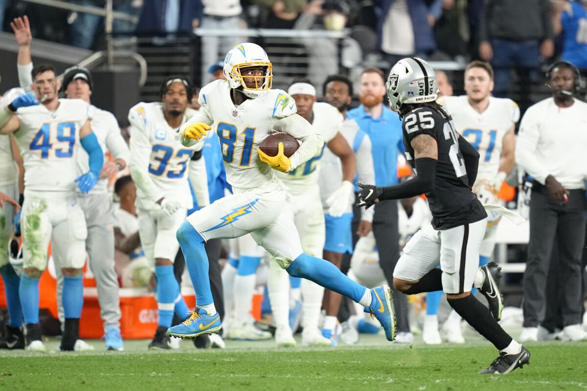 Chargers wide receiver Mike Williams runs after catching a pass in overtime against the Las Vegas Raiders.