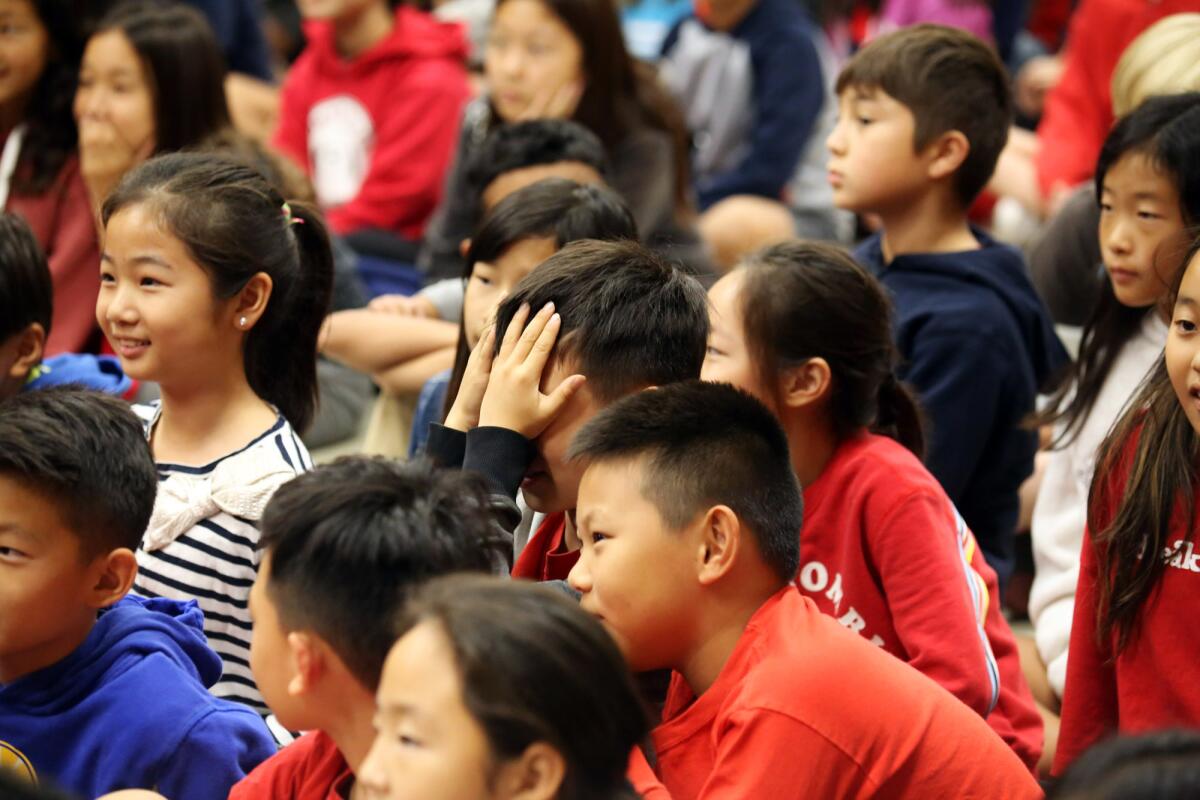 The dual-immersion Korean-language students at Monte Vista Elementary School have fun as they watch the Minnesota K-Pop Dance Crew perform at Monte Vista Elementary School in La Crescenta on Friday. K-Pop dance is a mix of hip-hop and Korean pop music and MKDC is the most popular K-Pop performance team in the Midwest.