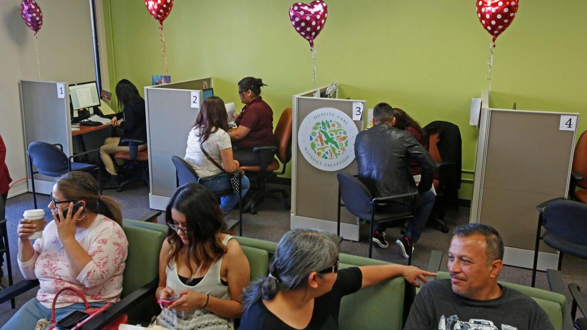 People sign up for Obamacare at AltMed Health Services in Los Angeles in 2015. This year's signups are complicated by the uncertainty surrounding federal support for cost-sharing subsidies.