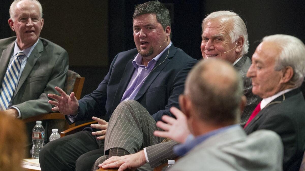 Newport Beach City Council candidate Mike Glenn, second from left, answers a question from former Daily Pilot Publisher Tom Johnson during a Feet to the Fire forum Wednesday night at Orange Coast College in Costa Mesa.