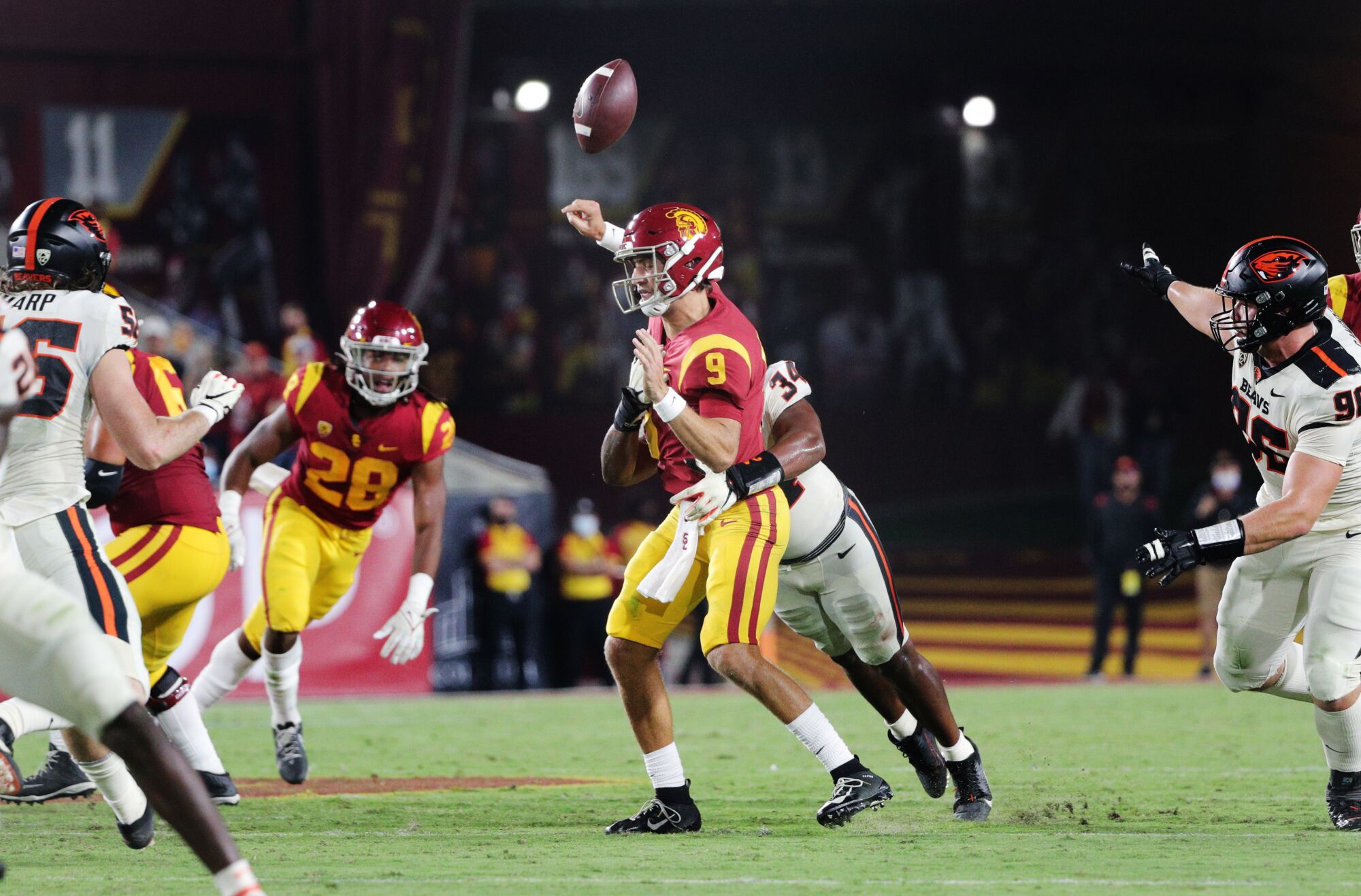 Oregon State linebacker Avery Roberts forces USC quarterback Kedon Slovis to fumble in the third quarter.