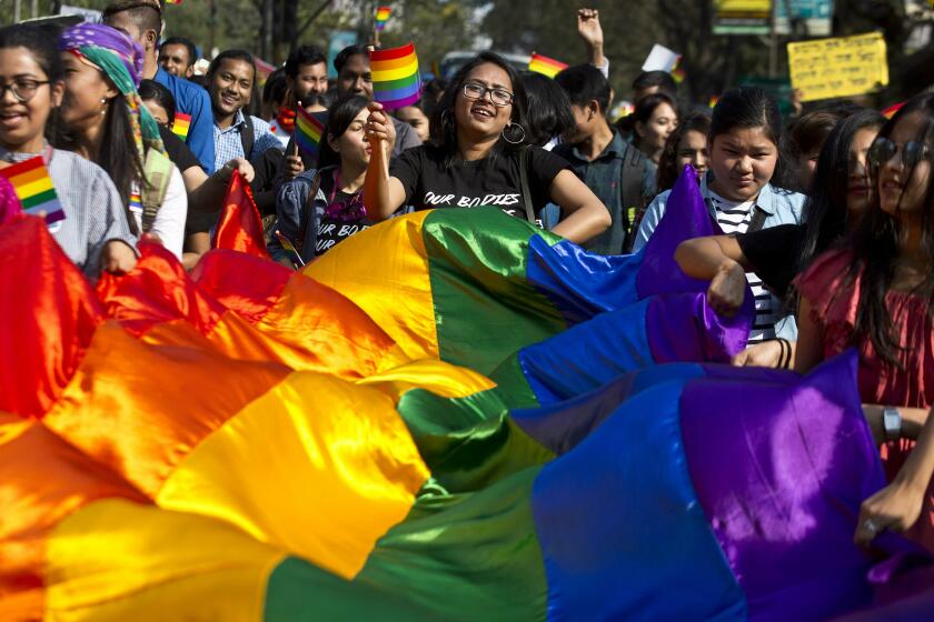 Supporters of the lesbian, gay, bisexual and transgender community participate in a gay pride parade in Gauhati, India, Sunday, Feb. 3, 2019. Homosexuality has gained a degree of acceptance in deeply conservative India over the past decade, particularly in big cities. (AP Photo/Anupam Nath)