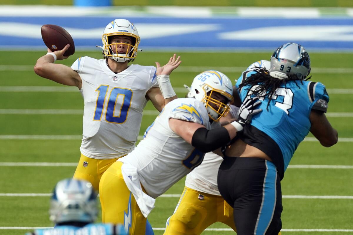 Justin Herbert prepares to pass against the Panthers.