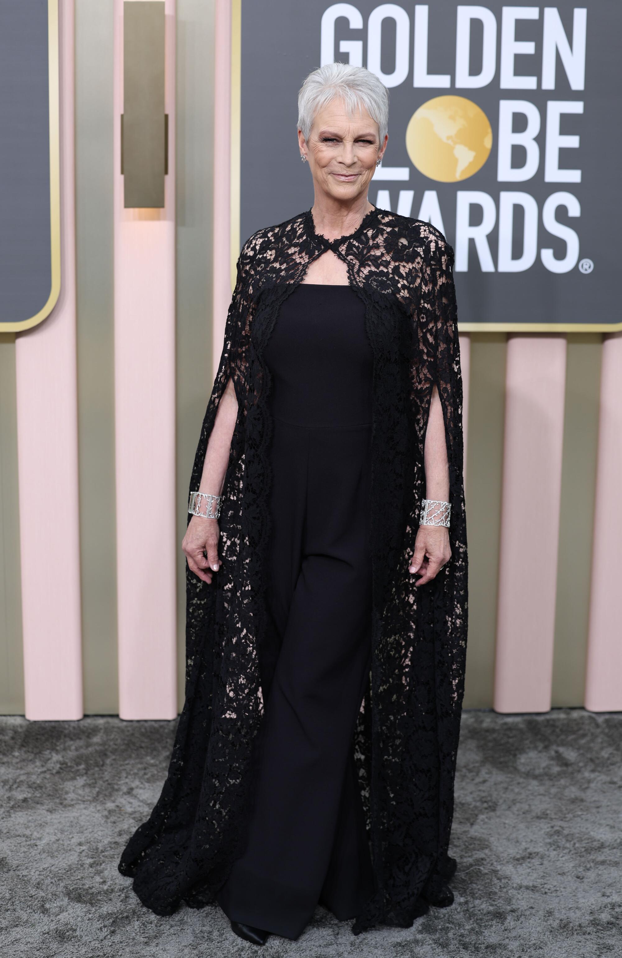 Jamie Lee Curtis poses in a Safiyaa jumpsuit at the Golden Globes