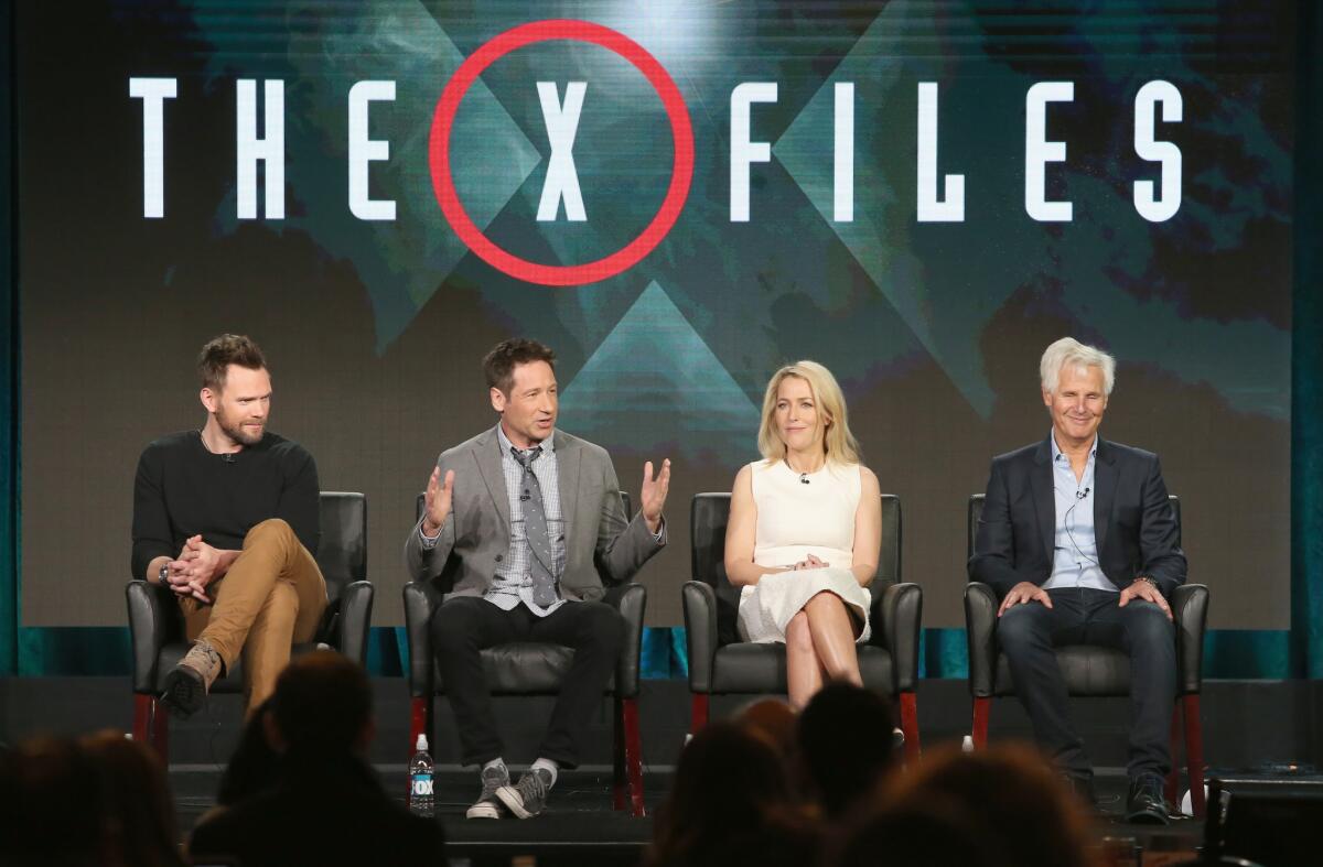 Actors Joel McHale, David Duchovny, Gillian Anderson and creator/executive producer Chris Carter speak onstage during "The X-Files" panel discussion.