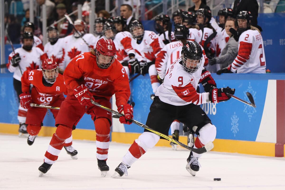 Canada's Jennifer Wakefield skates against Russia's Anna Shokhina during a women's hockey semifinal at the 2018 Winter Games on Feb. 19.
