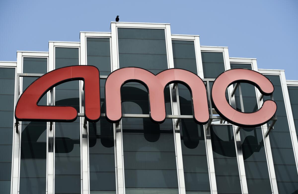 A large, red AMC logo hovering over an array of black-and-silver panels