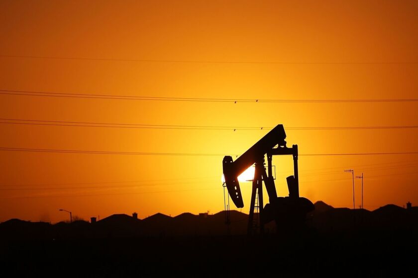 MIDLAND, TX - JANUARY 20: A pumpjack sits on the outskirts of town at dawn in the Permian Basin oil field on January 21, 2016 in the oil town of Midland, Texas. Despite recent drops in the price of oil, many residents of Andrews, and similar towns across the Permian, are trying to take the long view and stay optimistic. The Dow Jones industrial average plunged 540 points on Wednesday after crude oil plummeted another 7% and crashed below $27 a barrel. (Photo by Spencer Platt/Getty Images) ** OUTS - ELSENT, FPG, CM - OUTS * NM, PH, VA if sourced by CT, LA or MoD ** SOURCE Getty Images