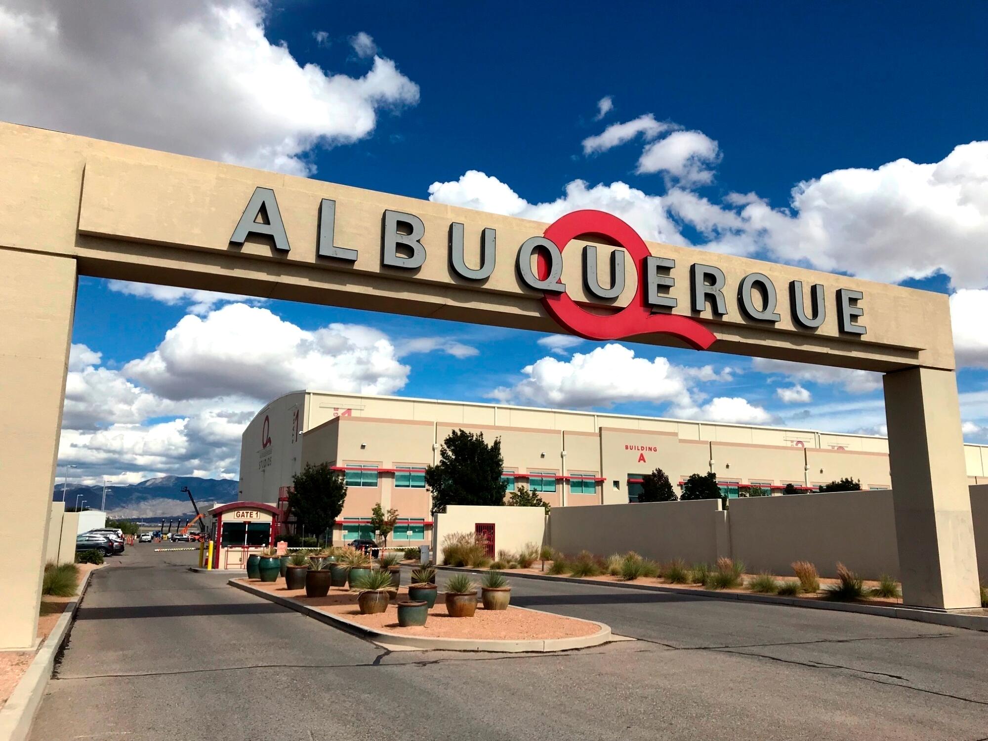 Arched entrance to a building complex reads "Albuquerque"