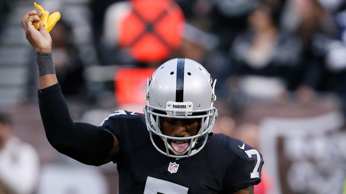 Raiders punter Marquette King dances with a penalty flag after the Buffalo Bills were penalized for roughing the kicker on Sunday.