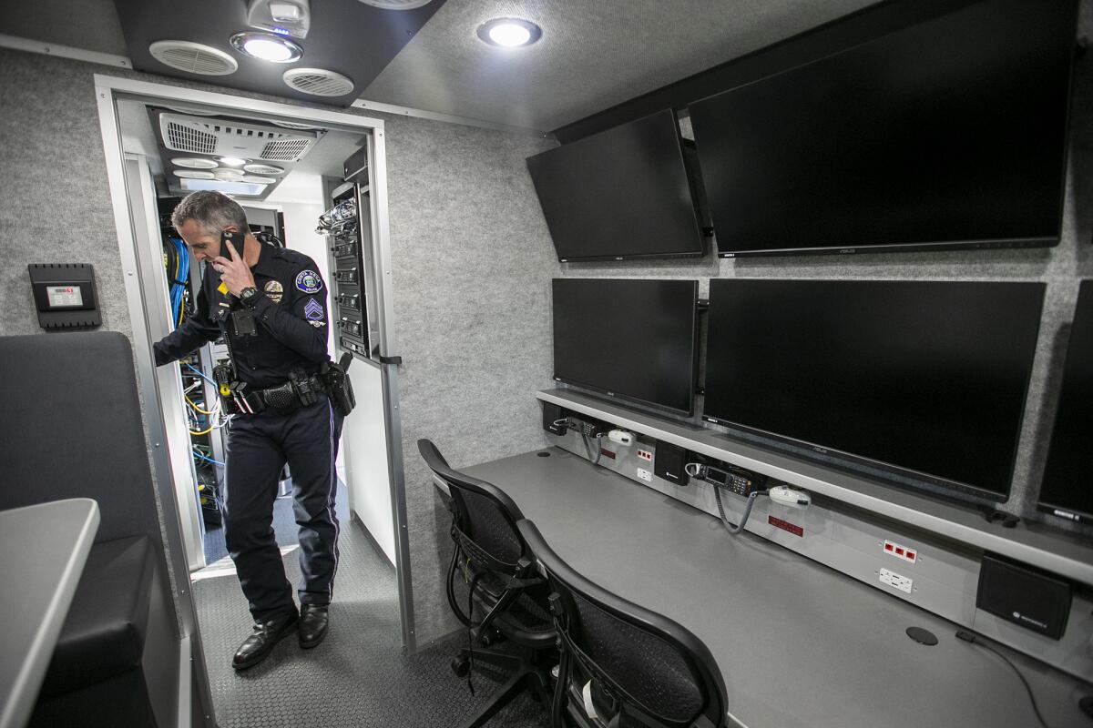 CMPD Sgt. Jared Barnes inside the police department's new mobile command vehicle Thursday.