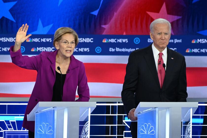 Democratic presidential hopefuls Massachusetts Senator Elizabeth Warren (L) and former Vice President Joe Biden participate of the fifth Democratic primary debate of the 2020 presidential campaign season co-hosted by MSNBC and The Washington Post at Tyler Perry Studios in Atlanta, Georgia on November 20, 2019. (Photo by SAUL LOEB / AFP) (Photo by SAUL LOEB/AFP via Getty Images) ** OUTS - ELSENT, FPG, CM - OUTS * NM, PH, VA if sourced by CT, LA or MoD **