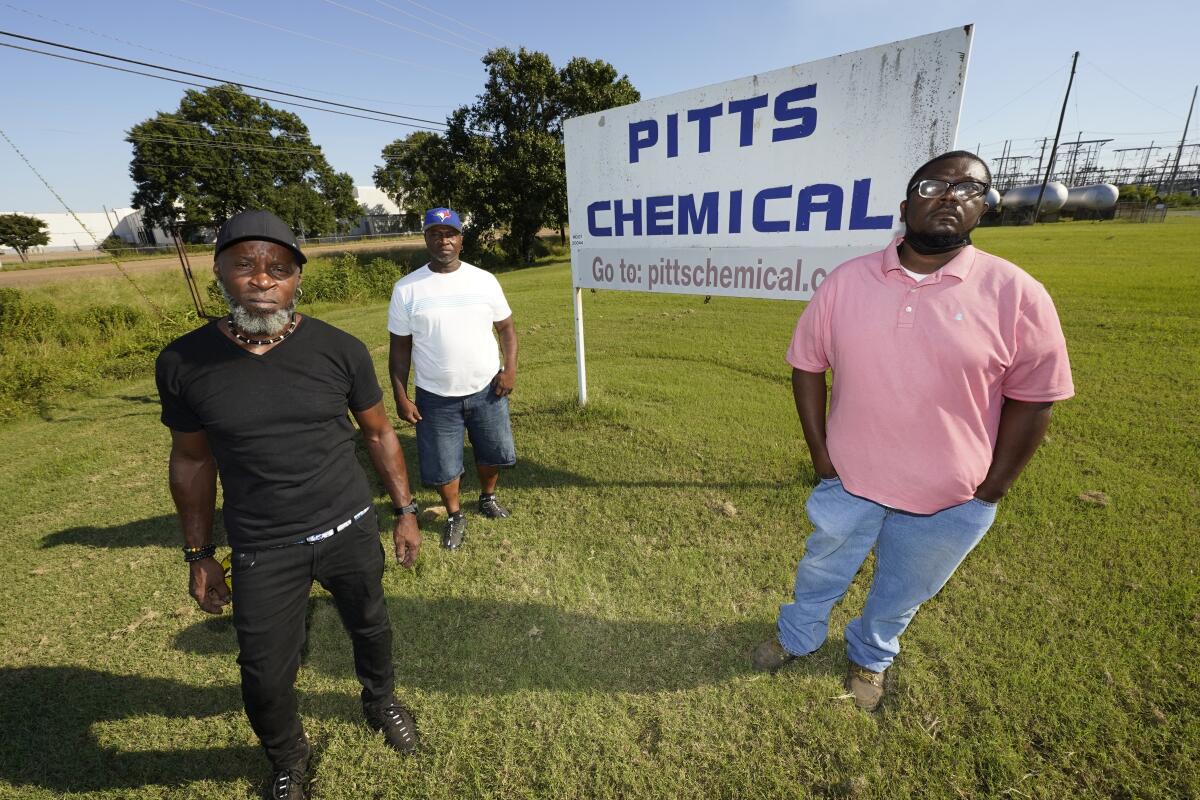 Richard Strong, 50, left, his brother Gregory Strong, 48, center and Stacy Griffin, 42, are among six Black farmworkers in Mississippi who say in a new lawsuit that their former employer, Pitts Farm Partnership, has brought white laborers from South Africa to do the same jobs they were doing, and that the farm has been violating federal law by paying the white immigrants significantly more for the same type of work, Thursday, Sept. 9, 2021, in Indianola, Miss. (AP Photo/Rogelio V. Solis)