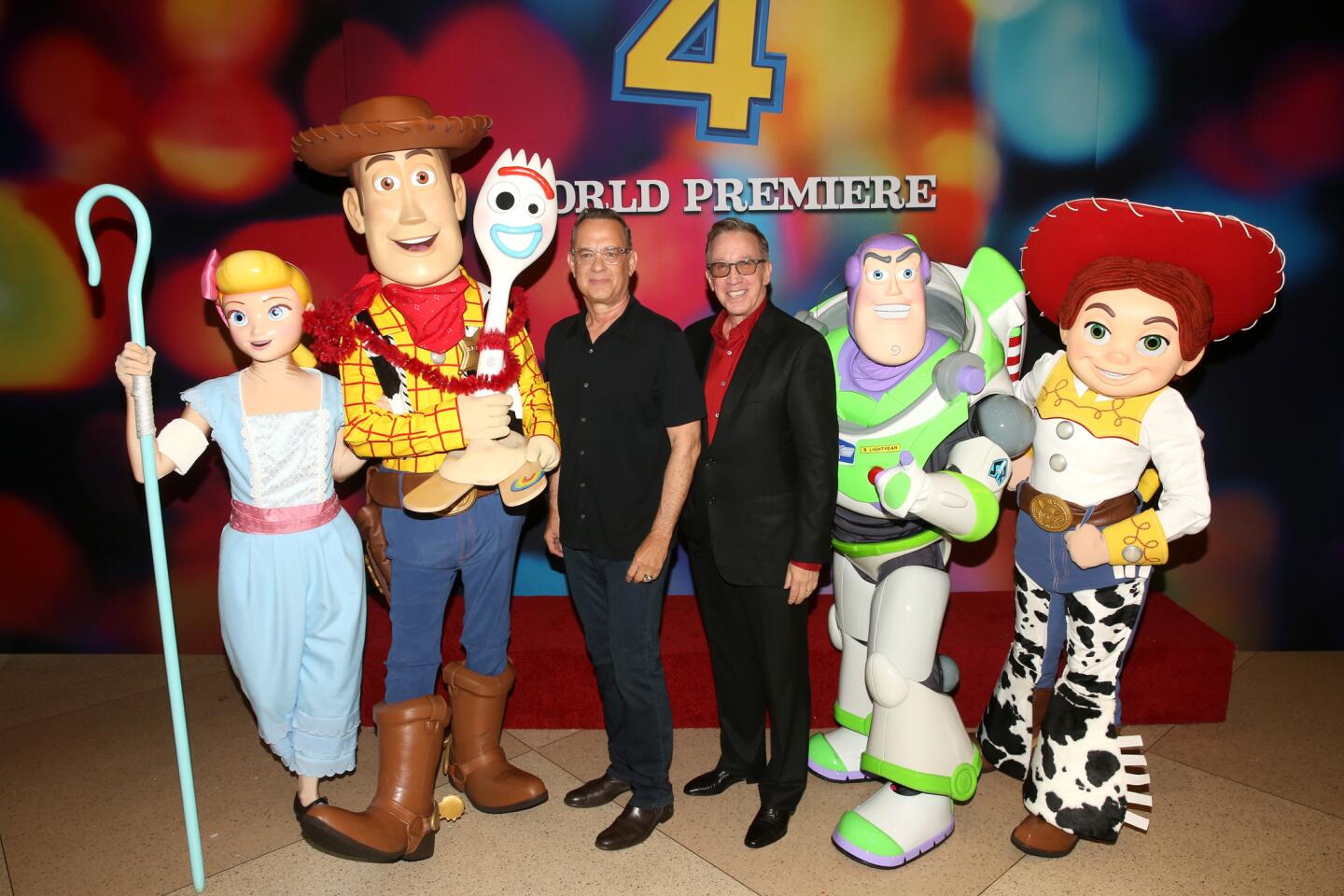 Tom Hanks (L) and Tim Allen pose with Bo Peep, Woody, Forky, Buzz Lightyear and Jessieat the world premiere of Disney and Pixar's "Toy Story 4" at the El Capitan Theatre in Hollywood, CA on Tuesday, June 11, 2019.
