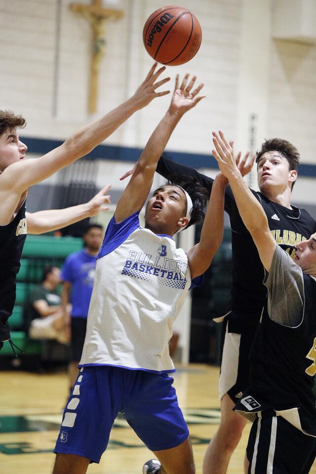 Burbank's Ruben Karakulyan drives and is not fouled while shooting by Calabasas in a summer league basketball game at Providence High School in Burbank on Wednesday, June 19, 2019.